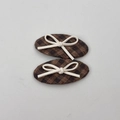 Detail view of plaid fabric hair clips in brown and black with small white bow accents - Coffee Plaid BB Hair Clips