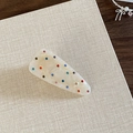 Close-up of marble pattern snap hair clip with colorful rhinestones on a beige background - Beige