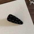 Dettaglio di un fermaglio geometrico nero per capelli con strass colorati e finitura lucida - Nero