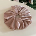 Close-up of pink velvet scrunchie showing plush fabric texture and soft sheen finish - Pink