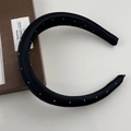 Detail of black satin headband featuring silver studded rivets for a premium hair style - Black