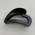 Detail of a large heart-shaped hair claw clip in glossy dark brown resin finish - Dark Brown