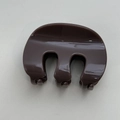 Close-up of a glossy dark coffee brown hair claw clip with smooth resin surface - Light Coffee