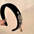 Close-up of black velvet headband with golden ethnic tassel and jhumka bell details - Single Side Gold Tassel Headband / Black