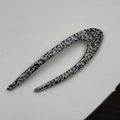 Detailed macro view of U-shaped acetate hair pin with black spots and sparkling crystals - Dotted Coffee