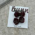 Detail of two handmade red plaid fabric bow hair clips set on a white bunny display card - Gingham Bow Hair Clips