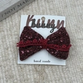 Close-up of sparkling dark red bow hair clip with lace detail on bunny card - Large Bow Hair Clip