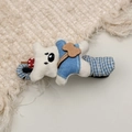 Detailed view of a cute plush white dog hair clip with blue striped overalls on a woven mat - White Bear Lazy Hair Clip