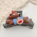 Detail view of plush bear hair claw clip with checkered fabric and blue sweater accent - Brown Dog Claw