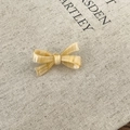 Macro detail of cream marble acetate bow hair clip showing the handmade lettering - Hair Clip / Yellow