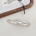Macro shot of French vintage acetate hair clip with pearlescent finish and metal clasp - Mermaid White