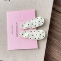 Detail of two French style polka dot hair clips on display card with wave texture - Creamy White Textured Waterdrop