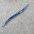 Detailed macro view of the marble-textured acetate hair stick with France Handmade engraving - Blue