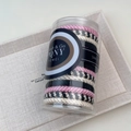 Close-up of high elasticity hand-woven hair ties in a clear storage cylinder tube - Pink and Black Series