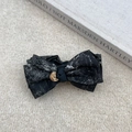 Elegant Chinese ink style bow hair clip with golden metallic detail on soft plush background - 水墨茹伊印花 / Black