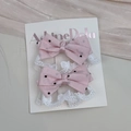 Detail of pink lace bow hair clips with black polka dots on white display card - Pink Bow Clip Set