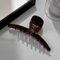 Dark brown acetate hair claw clip with France Handmade text on beige background - Large Cross