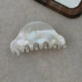 Close-up of pearl white acetate hair claw clip with Barrette la France logo engraving - Mermaid Color