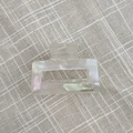 Detailed shot of rectangle acetate hair claw with cream mother-of-pearl texture and handmade logo - Mermaid Color