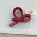 Elegant wine red hair claw clip with golden glitter finish and sleek double-loop design - Cross Knot Style