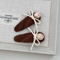 Detail of brown fabric hair clips with cream bows and pink satin roses on beige background - Coffee Ripple Bow Rose Clips / Coffee Pair