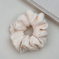 Detailed macro view of pink bubble gauze scrunchie with Korea label and soft texture - Cream White Seersucker Scrunchie / Off-White Hair Ring