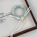 Pince à cheveux artisanale en laine bleu et vert avec une petite rose blanche élégante - Chouchou avec Nœud