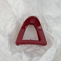 Macro detail of dark red triangular hair claw clip with glossy finish and metal spring - Burgundy Triangle Style
