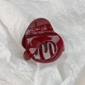 Detailed view of the dark red glossy hair claw clip featuring a strong metal spring - Burgundy Geometric Style