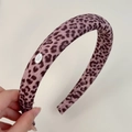 Elegant purple leopard print fabric headband with silver metallic logo plaque decoration - Leopard Pink Purple Headband
