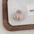 Detailed close-up of a pink pearlescent acetate hair claw with gold French lettering - Mermaid Colorful