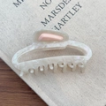 Detailed top view of a large cream acetate claw clip with pearlescent texture for thick hair - Mermaid Color