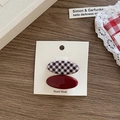 Set of two vintage red and brown plaid hair clips displayed on a handmade card - Oval Hair Clips