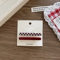 Retro hair clip set with one glossy dark red clip and one black and white plaid clip - Straight Style