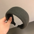 Detail of wide knitted headband showing dark teal textured yarn and inner non-slip lining - Gray