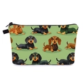 Detail view of the green dachshund print makeup bag with black zipper and woven loop - Light Green Cartoon Dachshund Style (hzb1467)