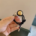 Elastico per capelli nero con disco dorato inciso e raffinata perla grigia lucida - Oro