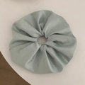 Detail of a large mint green satin scrunchie with soft folds and glossy texture - Extra Large Pleated Style