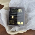 Detailed view of durable high-elastic woven hair bands in a branded clear display box - High Elasticity / Silver Gray