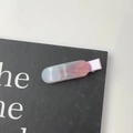 Close-up of a dreamy pink and blue gradient marble resin hair clip with silver glitter - Purple
