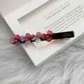 Detail of handmade acetate flower hair clip with rhinestones and France lettering - Rose Pink