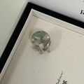Detail of a small acetate hair claw clip with pink and green marbled texture patterns - Green Pink
