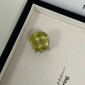 Detail of olive green acetate hair claw showing the France Handmade engraving - Green Lines Pattern