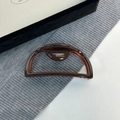 Detail view of the France Handmade gold stamp on a large tortoiseshell acetate hair claw - Chocolate