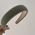 Close-up of military green vintage sponge headband with diagonal twill knit texture - Bean Green