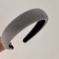 Detail showing grey ribbed twill fabric texture and black anti-slip lining of the headband - Gray