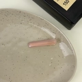 Close-up of pink acetate hair clip with gold France Handmade logo on a ceramic tray - Pink