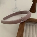 Close-up of velvet headband texture and circular silver metal plate decoration - Grey Pink