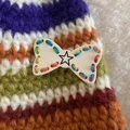 Handmade rainbow striped knitted hair clip with white bow and star detail accessory - Off White