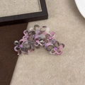 Detail of pink and gray acetate floral hair claw with sparkling purple rhinestones - Ink Wash Purple